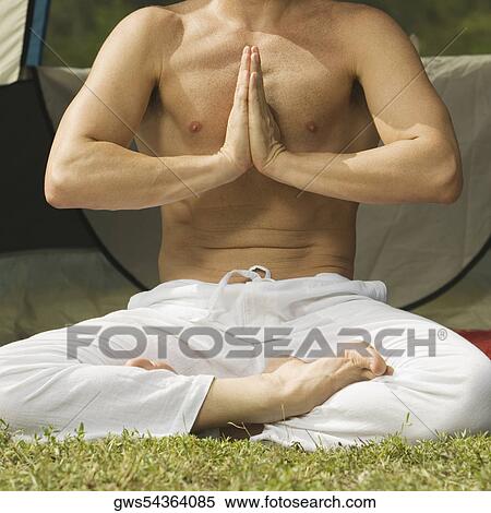 Close-up of a mid adult man in a prayer position View Large Photo Image Stock Photography - Close-up of a mid adult man in a prayer position. Fotosearch