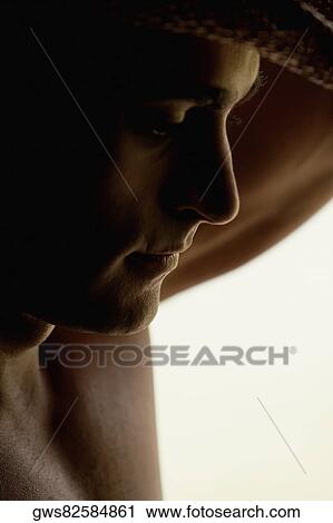 Close-up of a mid adult man thinking View Large Photo Image Stock Image - Close-up of a mid adult man thinking. Fotosearch