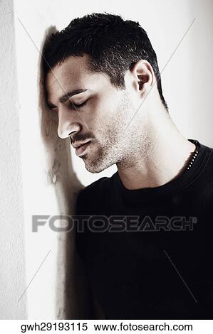 Stock Photography - Close-up of a mid adult man with his eyes closed. Fotosearch