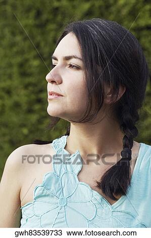 Close-up of a mid adult woman looking sideways View Large Photo Image Stock Image - Close-up of a mid adult woman looking sideways. Fotosearch
