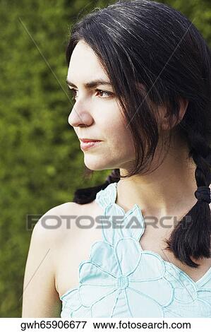 Stock Photo - Close-up of a mid adult woman looking sideways. Fotosearch