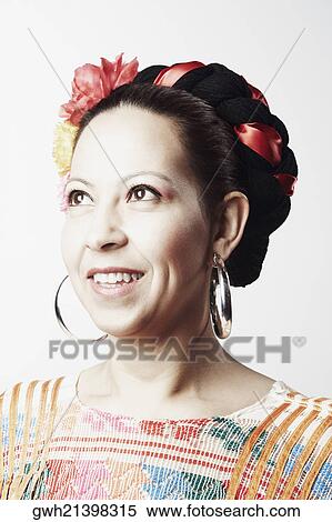 Close-up of a mid adult woman smiling and looking up View Large Photo Image Stock Photography - Close-up of a mid adult woman smiling and looking up. Fotosearch
