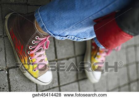 Close-up of a person's leg with shoes View Large Photo Image Stock Photo - Close-up of a person's leg with shoes. Fotosearch