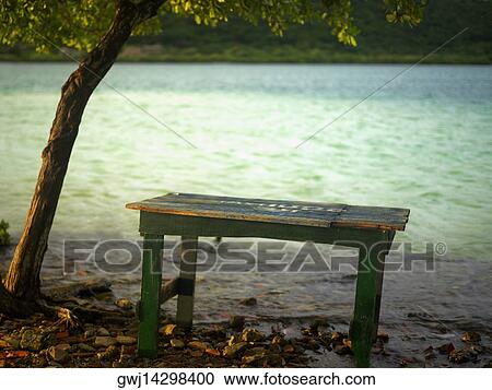 Stock Image - Close-up of a table at the riverbank. Fotosearch