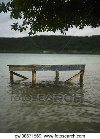 Stock Photo - Close-up of a table half submerged in the river. Fotosearch