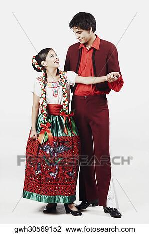 Close-up of a teenage couple looking at each other and smiling View Large Photo Image Stock Image - Close-up of a teenage couple looking at each other and smiling. Fotosearch