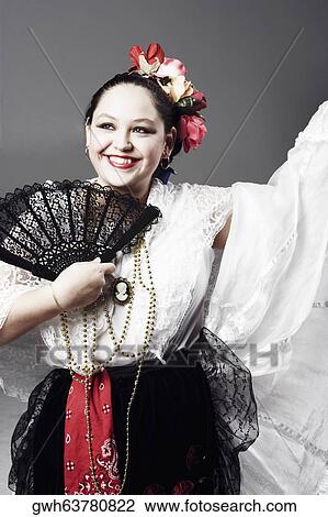 Close-up of a teenage girl holding a folding fan and posing View Large Photo Image Stock Image - Close-up of a teenage girl holding a folding fan and posing. Fotosearch