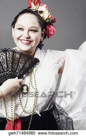 Close-up of a teenage girl holding a folding fan and posing View Large Photo Image Stock Photography - Close-up of a teenage girl holding a folding fan and posing. Fotosearch