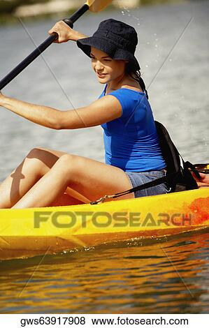 Close-up of a teenage girl kayaking View Large Photo Image Stock Photo - Close-up of a teenage girl kayaking. Fotosearch