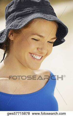 Stock Photo - Close-up of a teenage girl looking cheerful. Fotosearch
