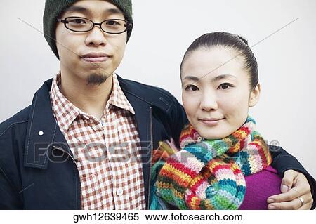 Stock Photography - Close-up of a young couple smiling. Fotosearch