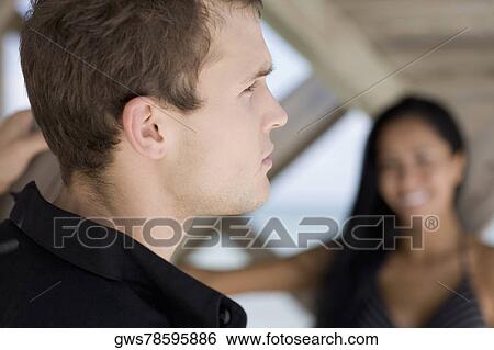 Close-up of a young couple View Large Photo Image Stock Photograph - Close-up of a young couple. Fotosearch