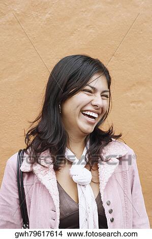 Picture - Close-up of a young woman laughing. Fotosearch