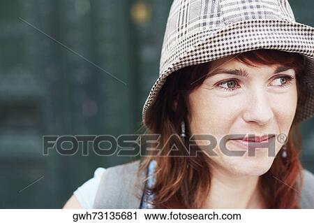 Stock Image - Close-up of a young woman looking away. Fotosearch