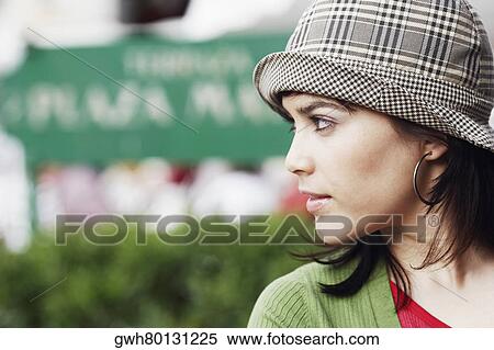 Stock Photography - Close-up of a young woman looking sideways . Fotosearch