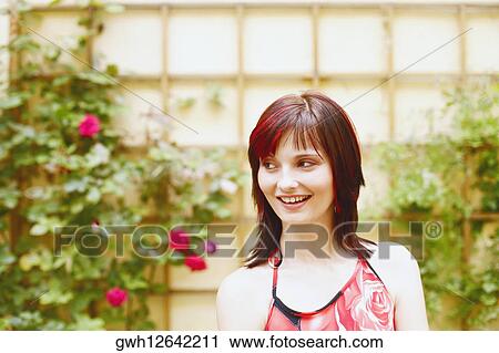 Close-up of a young woman smiling View Large Photo Image Stock Image - Close-up of a young woman smiling. Fotosearch