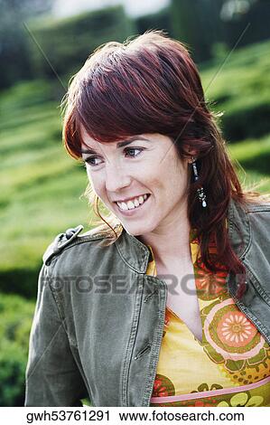 Stock Image - Close-up of a young woman smiling. Fotosearch