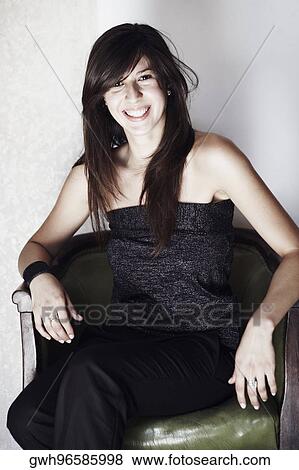 Close-up of a young woman smiling View Large Photo Image Stock Photo - Close-up of a young woman smiling. Fotosearch