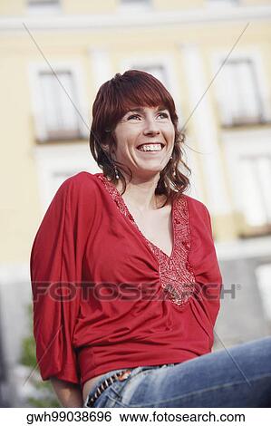 Stock Photograph - Close-up of a young woman smiling . Fotosearch