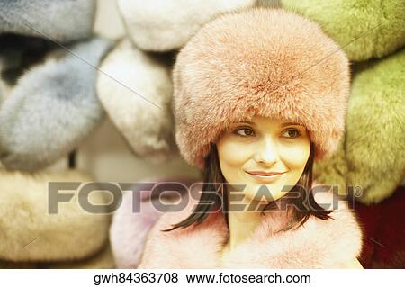 Stock Photo - Close-up of a young woman wearing a fur hat. Fotosearch