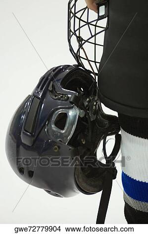 Close Up Of An Ice Hockey Player Holding A Helmet Picture Gwe Fotosearch