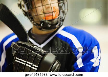 Close Up Of An Ice Hockey Player Holding An Ice Hockey Stick Stock Image Gwe Fotosearch