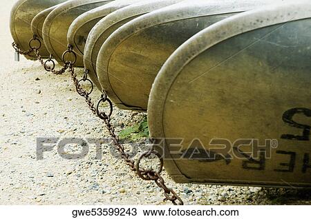 Stock Image - Close-up of boats moored at dock. Fotosearch