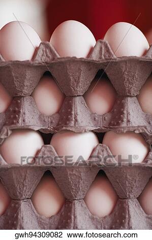 Stock Image - Close-up of chicken eggs in trays. Fotosearch