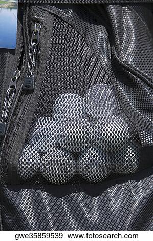 Close-up of golf balls in a golf bag View Large Photo Image Stock Photo - Close-up of golf balls in a golf bag. Fotosearch