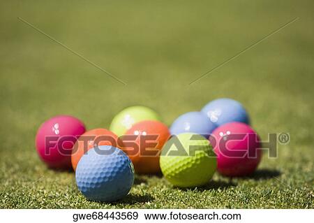 Close-up of golf balls on the grass View Large Photo Image Stock Photo - Close-up of golf balls on the grass. Fotosearch