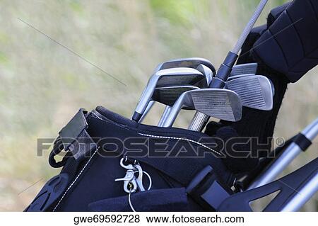 Close-up of golf clubs in a golf bag View Large Photo Image Stock Photo - Close-up of golf clubs in a golf bag. Fotosearch