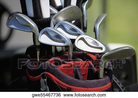 Stock Photograph - Close-up of golf clubs in a golf bag. Fotosearch