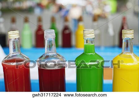 Close-up of soft drinks in bottles View Large Photo Image Picture - Close-up of soft drinks in bottles. Fotosearch