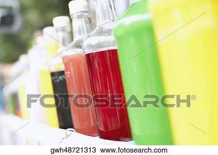 Close-up of soft drinks in bottles View Large Photo Image Stock Image - Close-up of soft drinks in bottles. Fotosearch