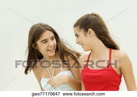 Close-up of two girls smiling View Large Photo Image Stock Photo - Close-up of two girls smiling. Fotosearch