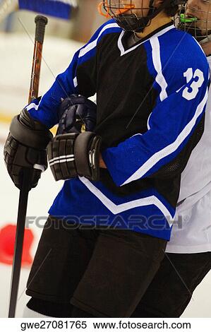 Stock Photography - Close-up of two ice hockey players. Fotosearch