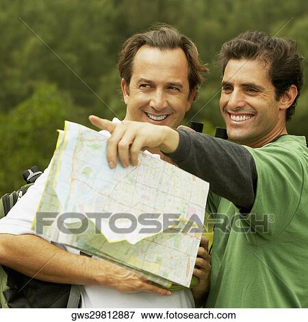 Close-up of two mid adult men smiling View Large Photo Image Stock Photo - Close-up of two mid adult men smiling. Fotosearch