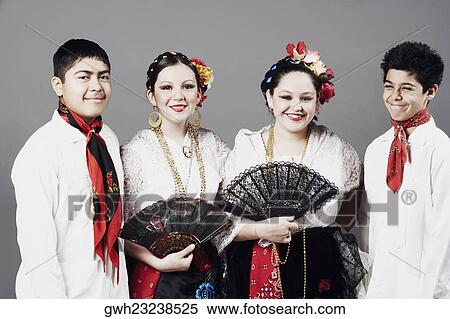Close-up of two teenage boys and two teenage girls standing together and posing View Large Photo Image Stock Photography - Close-up of two teenage boys and two teenage girls standing together and posing. Fotosearch