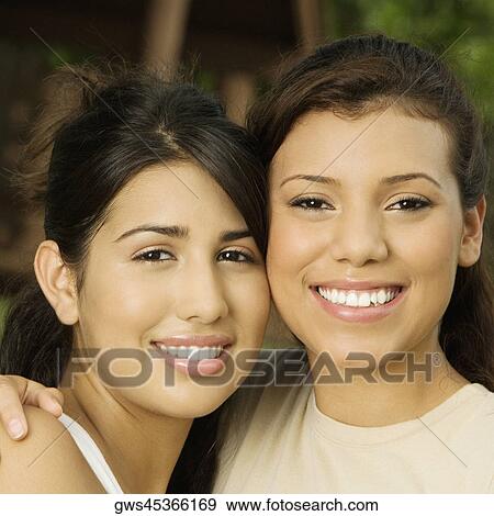 Close-up of two teenage girls smiling View Large Photo Image Stock Photo - Close-up of two teenage girls smiling. Fotosearch