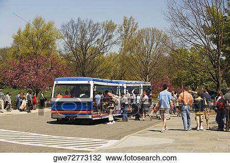 Commuters boarding a bus on the road View Large Photo Image Stock Image - Commuters boarding a bus on the road. Fotosearch