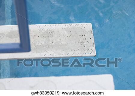 Stock Photo - Diving board near a swimming pool. Fotosearch