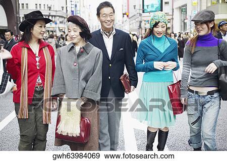Family walking on the street View Large Photo Image Stock Photo - Family walking on the street . Fotosearch