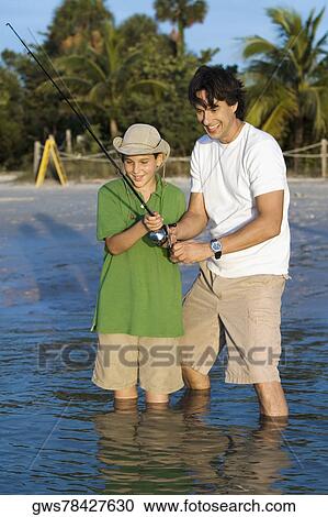 Father and his son fishing View Large Photo Image Stock Image - Father and his son fishing. Fotosearch