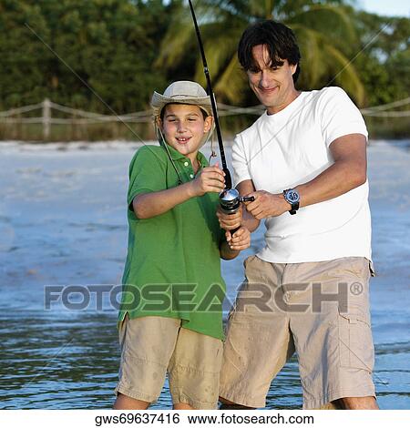 Stock Photograph - Father and his son fishing. Fotosearch