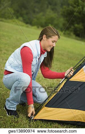 Girl adjusting a tent View Large Photo Image Picture - Girl adjusting a tent. Fotosearch