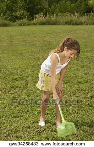 Girl using a butterfly net View Large Photo Image Stock Image - Girl using a butterfly net. Fotosearch