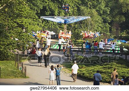 Group of people in a park View Large Photo Image Stock Photograph - Group of people in a park. Fotosearch
