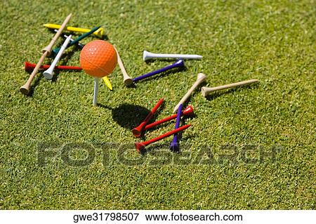 Stock Photo - High angle view of a golf ball and tees. Fotosearch