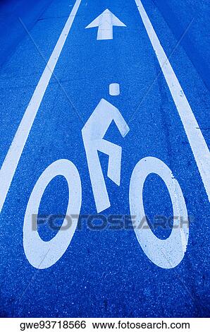 Stock Photograph - High angle view of a human representation painted on the road. Fotosearch