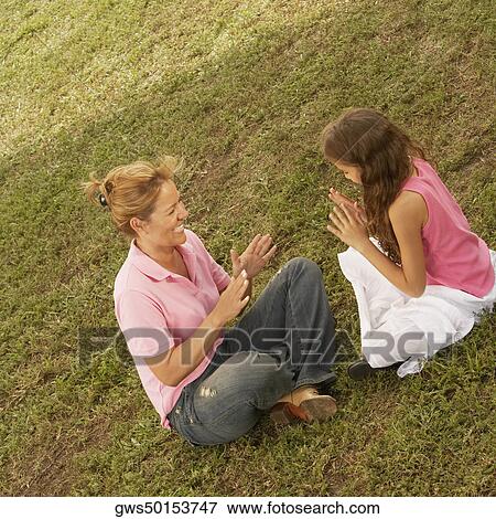 High angle view of a mature woman playing with her daughter in the park View Large Photo Image Stock Photo - High angle view of a mature woman playing with her daughter in the park. Fotosearch